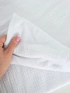 Detaliu textura muselina Optic White din bumbac